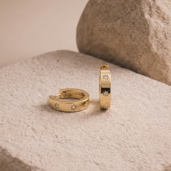 Aurora Star Huggie Hoop Earrings in Yellow Gold